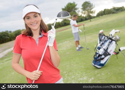 women player golf swing shot on course