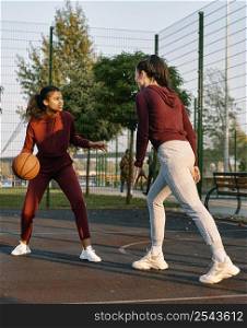 women playing together basketball game 2