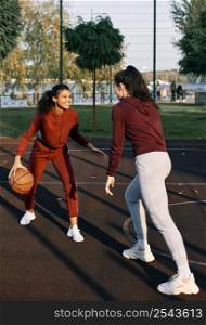 women playing together basketball game