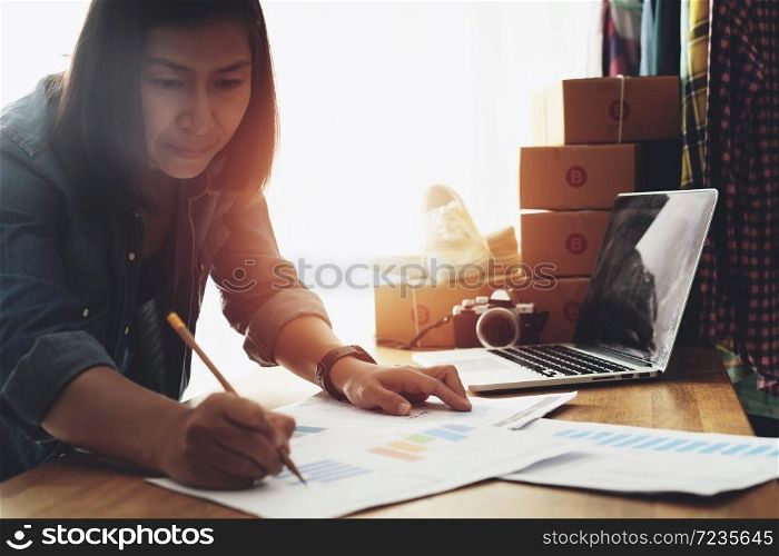 Women pointing at business document with on home office table, Online selling e-commerce shipping idea concept freelance start up small business owner