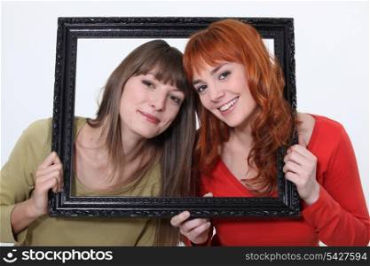Women posed in a frame