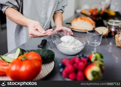 Women preparing healthy food playing with vegetables in kitchen having fun concept dieting nutrition.