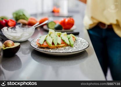 Women preparing healthy food playing with vegetables in kitchen having fun concept dieting nutrition.