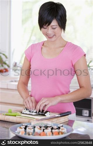 Women Preparing Sushi Rolls