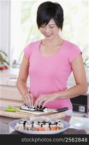 Women Preparing Sushi Rolls