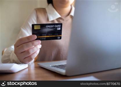 Women purchasing online using credit card payments via laptop, Shopping online and banking online concept