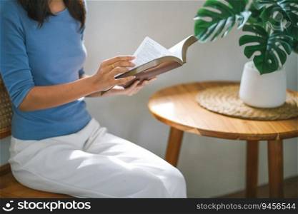 Women reading book and relaxing at home and comfort in front of opened book.