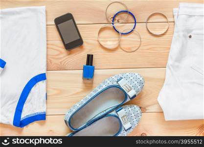 women&rsquo;s clothing and matching accessories on wooden boards