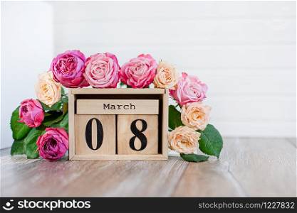 Women&rsquo;s Day. March 8 tree calendar, International Women&rsquo;s Day, decorated with pink and purple flowers on a pink background.. March 8 tree calendar, International Women&rsquo;s Day, decorated with pink and purple flowers on a pink background.