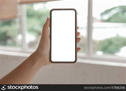Women&rsquo;s hands holding cell telephone blank copy space screen. smartphone with blank white screen isolated. smart phone with technology concept
