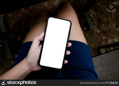 Women&rsquo;s hands holding cell telephone watching social media in a smart phone. social network concept with smart phone.