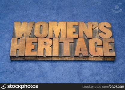 women&rsquo;s heritage word abstract in vintage letterpress wood type against blue handmade paper