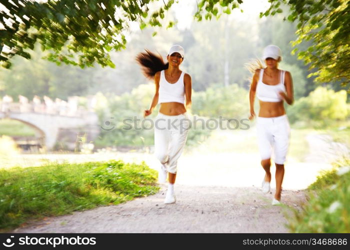 women run by sunny park alley