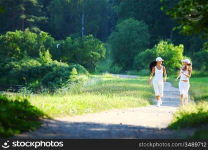 women run by sunny park alley