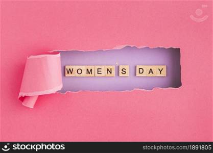 women s day written in scrabble letters and torn paper. Resolution and high quality beautiful photo. women s day written in scrabble letters and torn paper. High quality and resolution beautiful photo concept