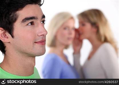 women sharing secrets about young man