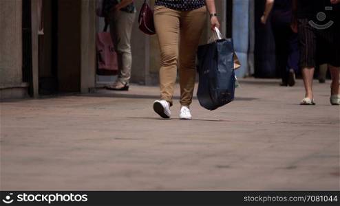 Women shoppers carrying bags
