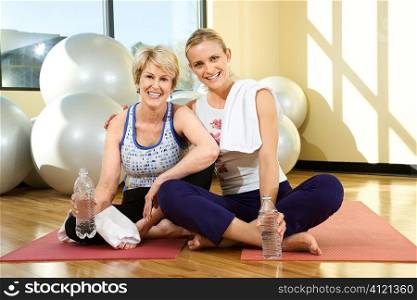 Women Sitting and Smiling at Gym