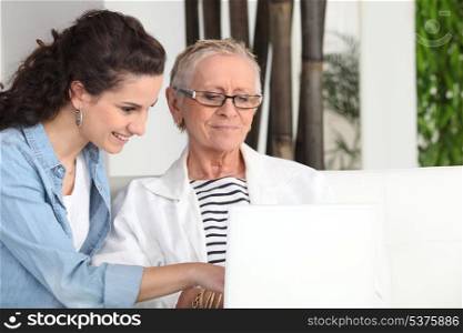 Women sitting at a laptop