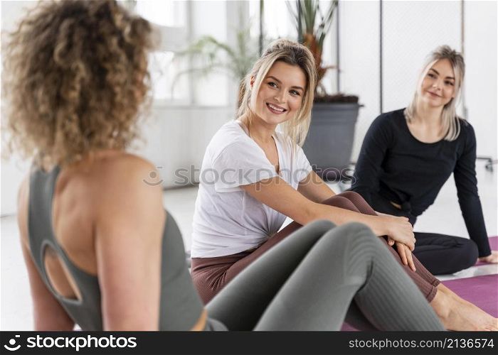 women sitting mats