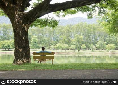 women sitting on the bench in the park