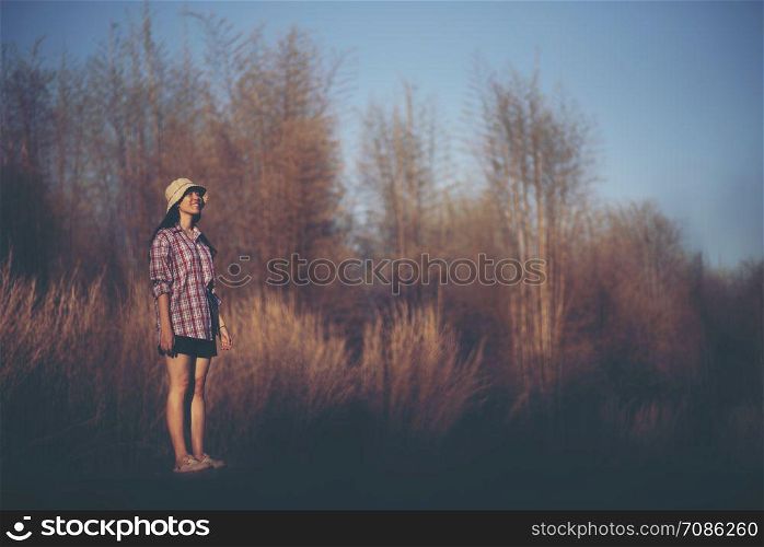 women standing alone with nature