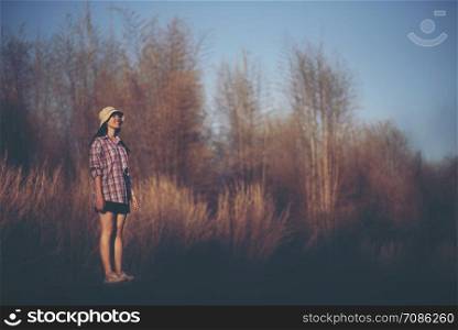 women standing alone with nature