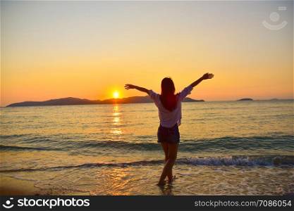 Women Standing on Beach at Sea And Sunset Background Summer Holidays