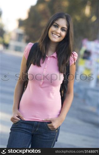 Women standing outdoors smiling (selective focus)