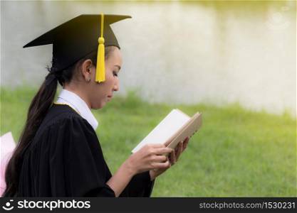 Women Student Graduate reading book in Commencement day