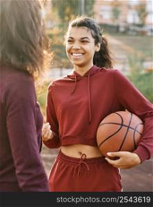 women talking about basketball game