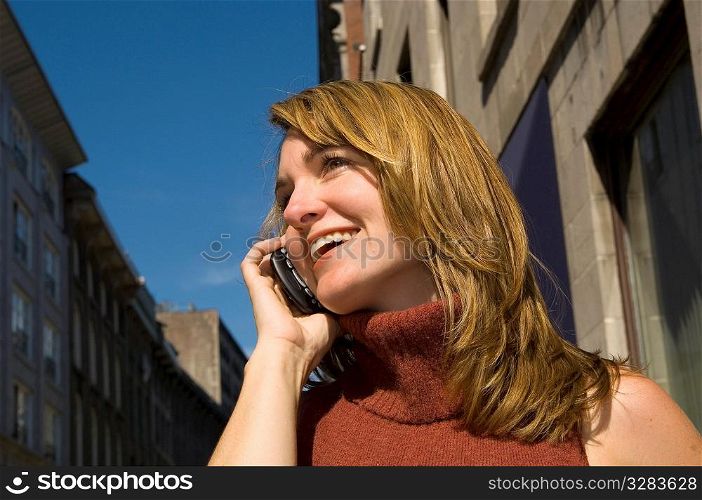 Women talking on PDA, cell phone