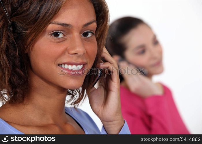 Women talking on their phones