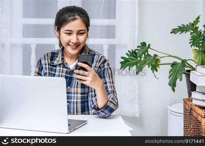 Women use laptops in the office with pleasure.