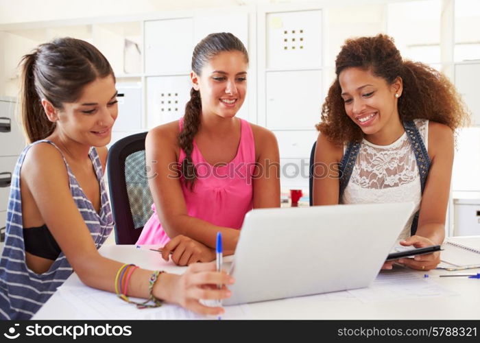 Women Using Laptop In Modern Office Of Start Up Business