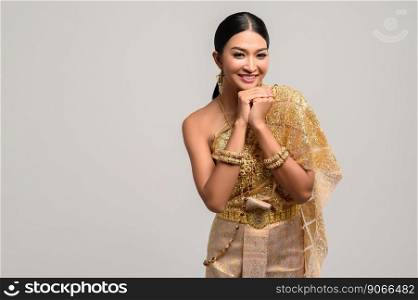Women wearing Thai clothes and hands touching the chin