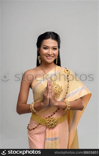 Women wearing Thai clothing that Pay respect,sawasdee symbol