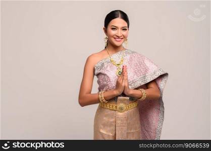 Women wearing Thai clothing that Pay respect,sawasdee symbol