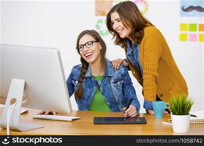 Women working at desk In a creative office, team work