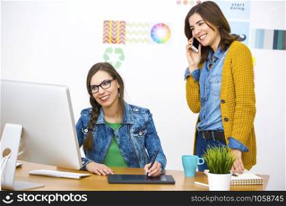 Women working at desk In a creative office, team work
