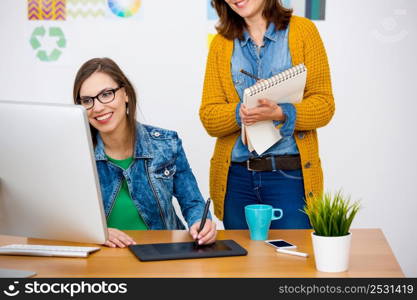 Women working at desk In a creative office, team work