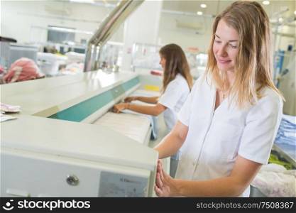 Women working in industrial laundry