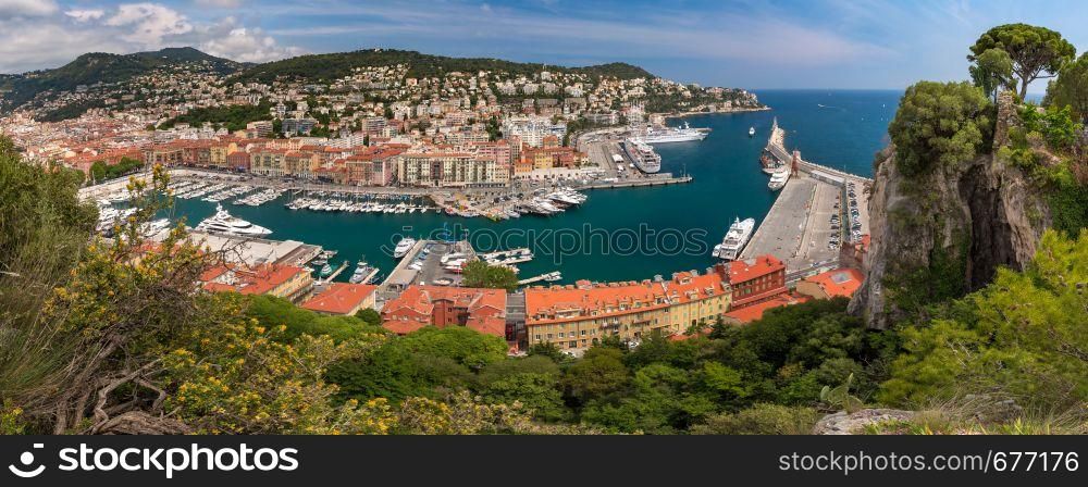 Wonderful aerial panoramic view of Nice Old port and colorful historical houses in the sunny summer day with blue sky, Nice, French Riviera, Cote d'Azur, France. Old Port in Nice, France