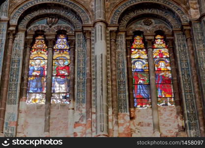 Wonderful ancient stained glass window formed of multiple colors. Stained glass window