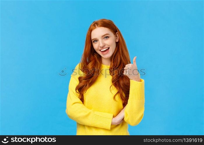 Wonderful idea. Supportive cute redhead girlfriend encourage you try, approve good choice, smiling pleased, nod approval and showing thumb-up like gesture, stand blue background.. Wonderful idea. Supportive cute redhead girlfriend encourage you try, approve good choice, smiling pleased, nod approval and showing thumb-up like gesture, stand blue background
