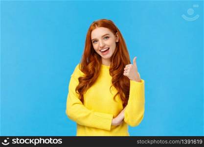 Wonderful idea. Supportive cute redhead girlfriend encourage you try, approve good choice, smiling pleased, nod approval and showing thumb-up like gesture, stand blue background.. Wonderful idea. Supportive cute redhead girlfriend encourage you try, approve good choice, smiling pleased, nod approval and showing thumb-up like gesture, stand blue background
