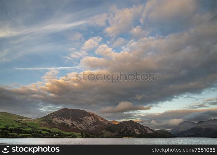 Wonderful landscape image looking across Ennerdale Water in the English Lake District towards the peaks of Scoat Fell and Pillar during a glorious Summer sunset