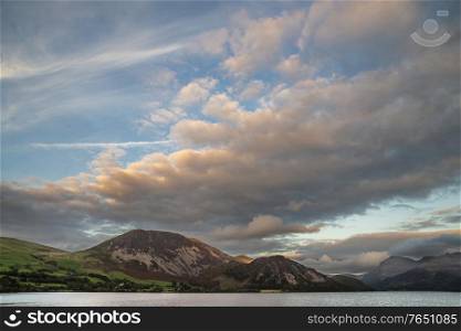 Wonderful landscape image looking across Ennerdale Water in the English Lake District towards the peaks of Scoat Fell and Pillar during a glorious Summer sunset