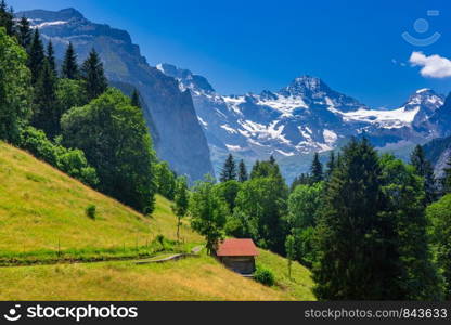 Wonderful mountain car-free village Wengen, Bernese Oberland, Switzerland. The Jungfrau is visible in the background. Mountain village Wengen, Switzerland
