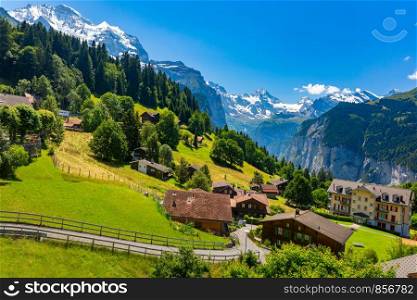 Wonderful mountain car-free village Wengen, Bernese Oberland, Switzerland. The Jungfrau is visible in the background. Mountain village Wengen, Switzerland